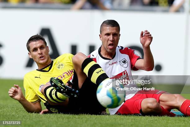 Sebastian Kehl of Dortmund and David Jahdadic Wilhelmshaven compete for the ball during the first round of DFB Cup match between SV Wilhelmshaven and...