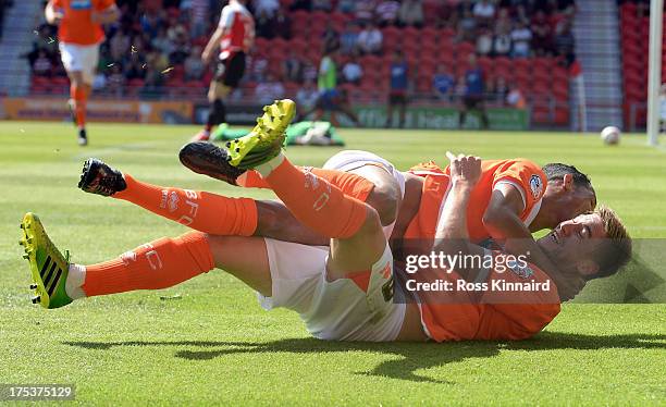 Steven Davies of Blackpool celebrates with Tom Ince of Blackpool after opening the scoring during the Sky Bet Championship match between Doncaster...