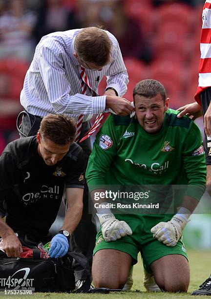 Ross Turnbull of Doncaster is injured during the Sky Bet Championship match between Doncaster Rovers and Blackpool at Keepmoat Stadium on August 03,...