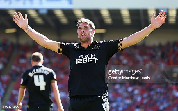 Grant Holt of Wigan Athletic celebrates his goal during the Sky Bet Championship match between Barnsley and Wigan Athletic at Oakwell on August 03,...