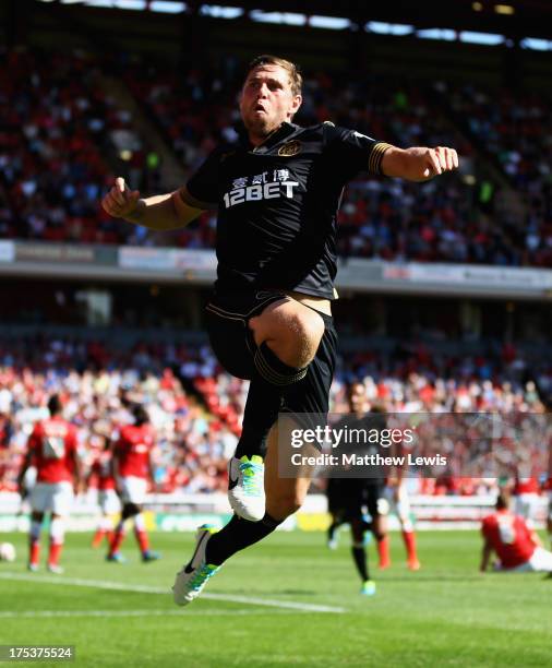 Grant Holt of Wigan Athletic celebrates his goal during the Sky Bet Championship match between Barnsley and Wigan Athletic at Oakwell on August 03,...