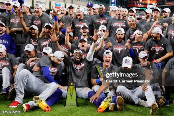 Members of the Texas Rangers pose for a photo after Game 7 of the ALCS between the Texas Rangers and the Houston Astros at Minute Maid Park on...