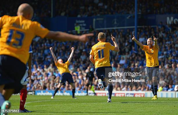 Alfie Potter of Oxford celebrates with Sean Rigg after scoring his side's third goal during the Sky Bet League Two match between Portsmouth and...