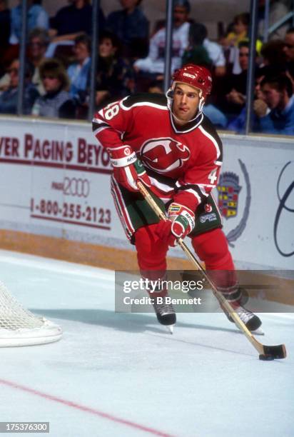 Scott Niedermayer of the New Jersey Devils skates with the puck during an NHL game circa 1992.