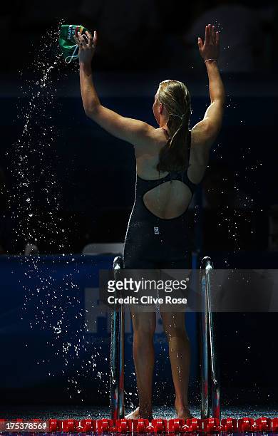 Ruta Meilutyte of Lithuania celebrates setting a new World Record time of 29.48 in the Swimming Women's Breaststroke 50m Semifinal heat 2 on day...