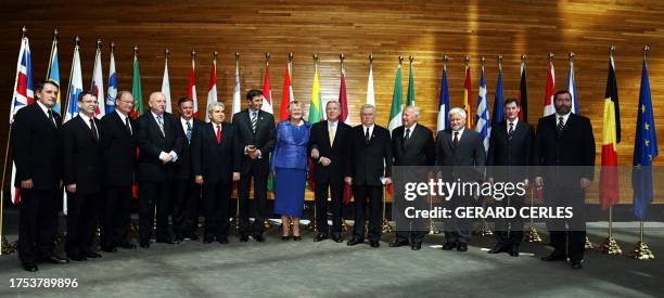 Former Polish president Lech Walesa , flanked by European Parliament President Pat Cox, poses 03 May 2004 in Strasbourg with Andris Argalis , Lubomir...