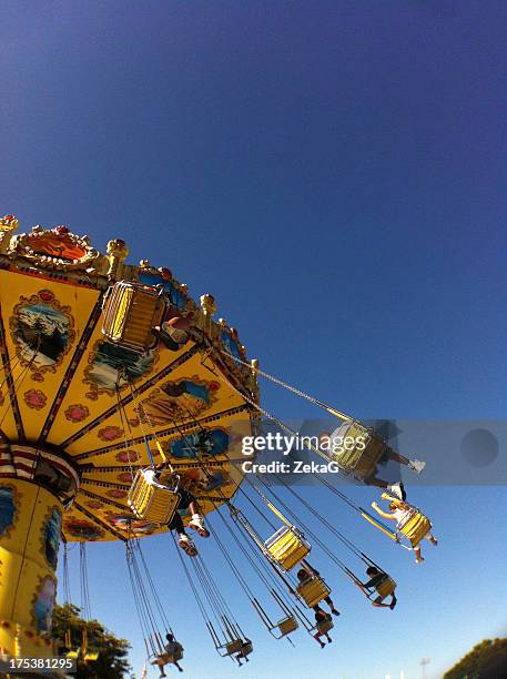 fair carousel - zweefmolen stockfoto's en -beelden