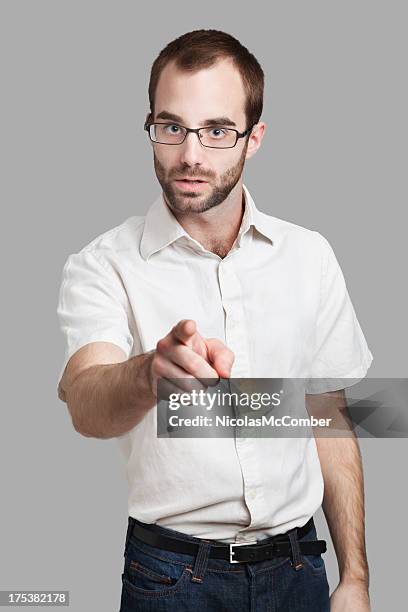 threatening young man pointing finger - scolding stock pictures, royalty-free photos & images