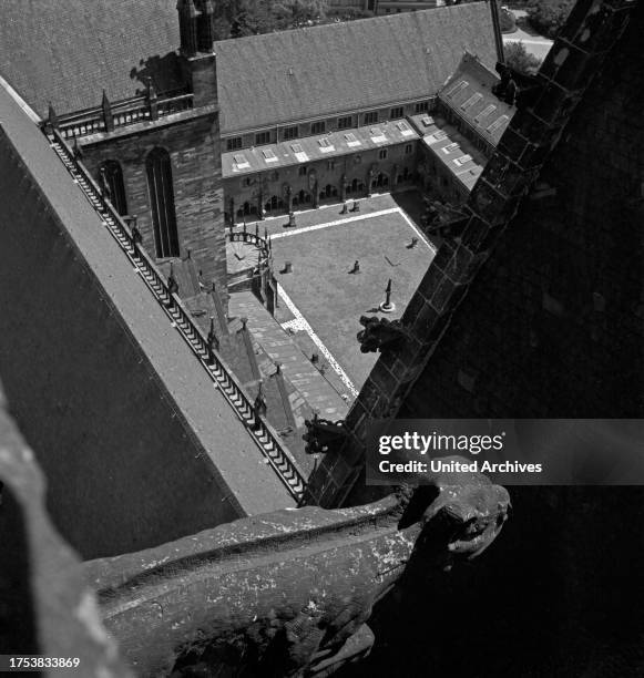 Aerial view from the belfry of the Magdeburg cathedral to a gargoyle into the cathedral's courtyard, Germany 1930s.