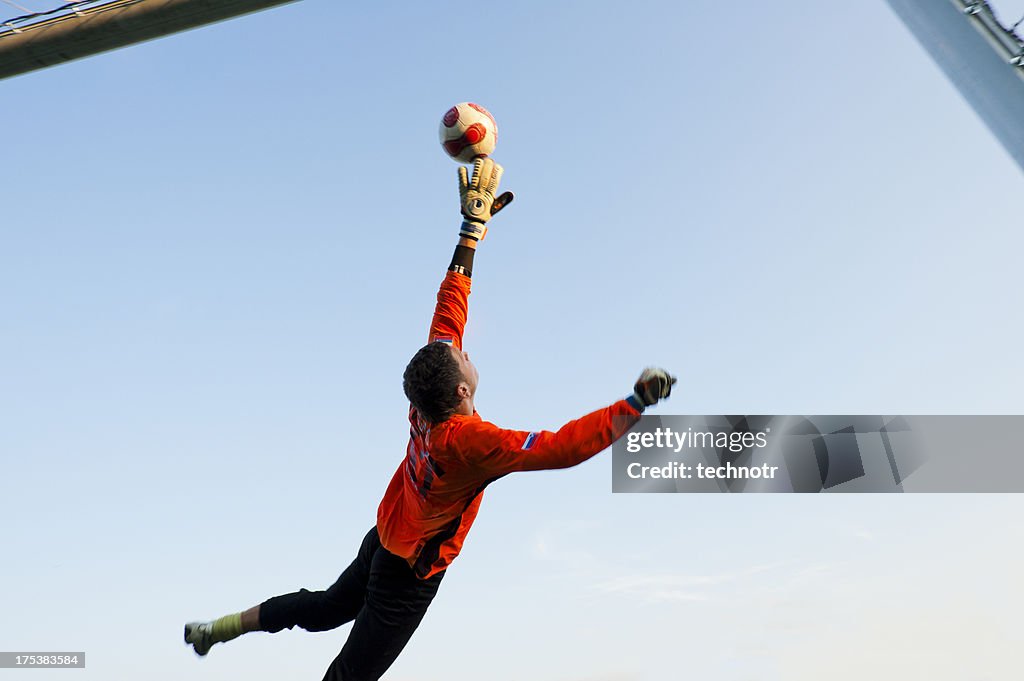 Soccer goalie in mid-air