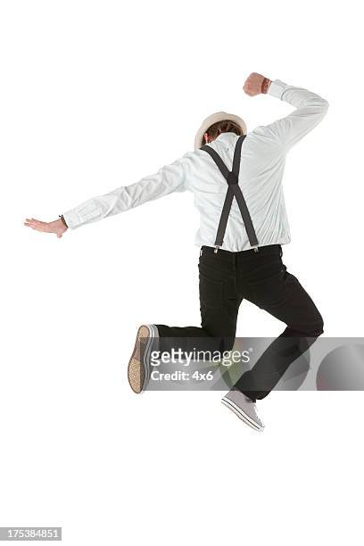 rear view of a man jumping - suspenders stock pictures, royalty-free photos & images