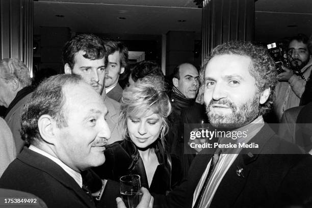 Donnatella Versace, designer Gianni Versace, and guest