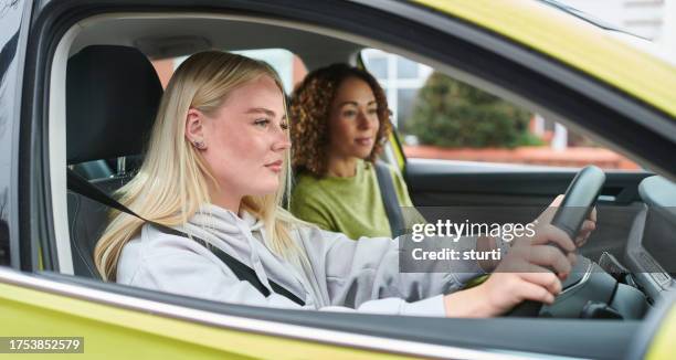 learner driver with instructor - right hand drive stock pictures, royalty-free photos & images
