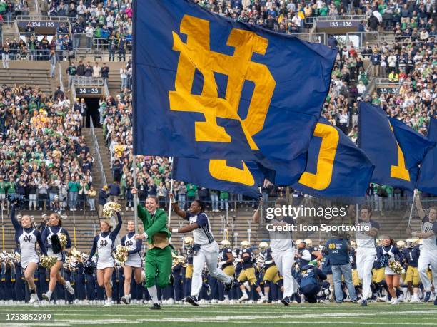 Notre Dame Fighting Irish female football mascot Kylee Kazenski takes the field before the college football game between the Pittsburgh Panthers and...