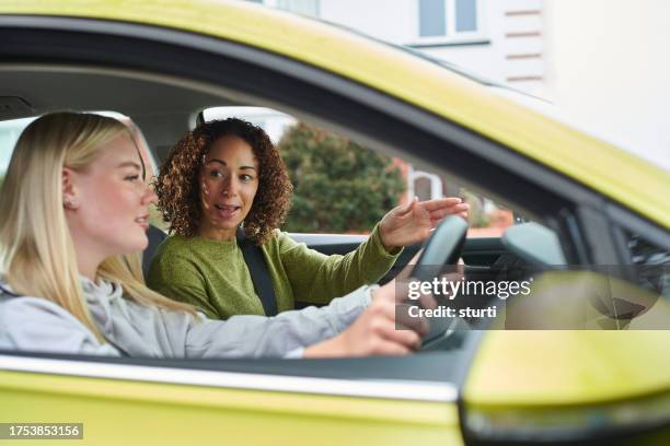learner driver with instructor - right hand drive stock pictures, royalty-free photos & images