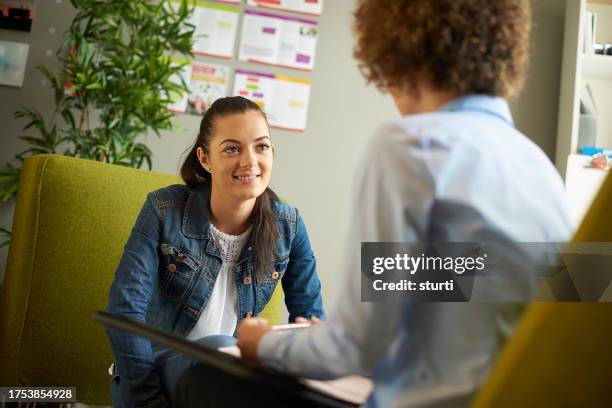 young woman in counselling session - student advisor stock pictures, royalty-free photos & images
