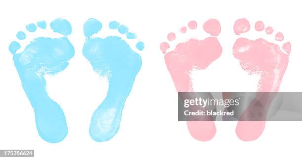 baby boy and girl footprints - baby boys stock pictures, royalty-free photos & images