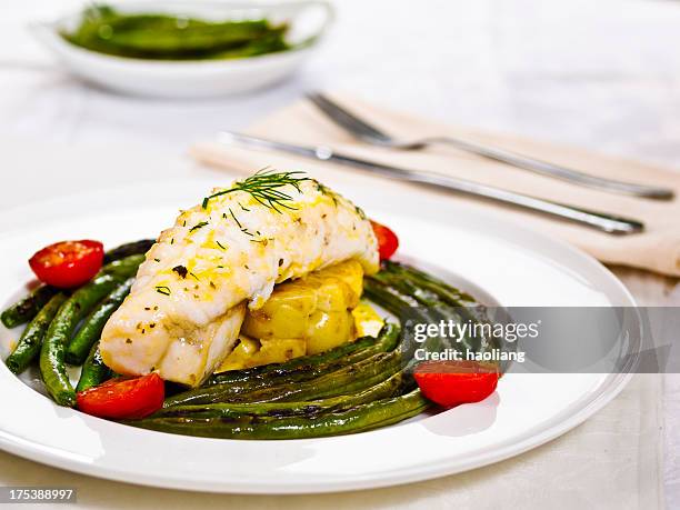 panfryed monkfish tail with vegetables plated formally - anglerfish stock pictures, royalty-free photos & images