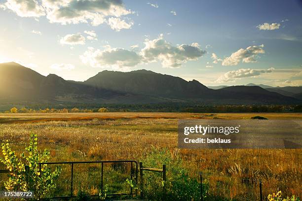 sun setting behind boulder colorado - university of colorado in boulder stock pictures, royalty-free photos & images