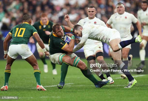 Duane Vermeulen of South Africa is tackled by Elliot Daly of England during the Rugby World Cup France 2023 match between England and South Africa at...