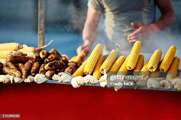 roasted corn on the cob cooking - corncob towers stock pictures, royalty-free photos & images