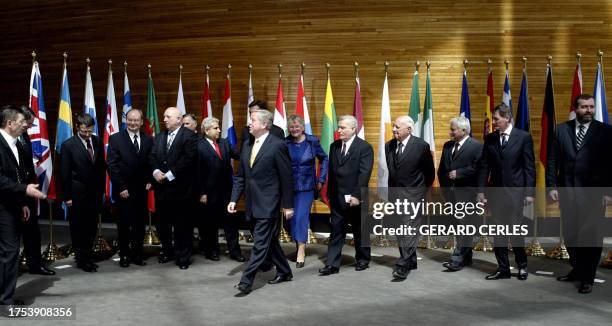European Parliament President Pat Cox leaves after posing 03 May 2004 in Strasbourg with parliament speakers of the 10 new European members. EU...