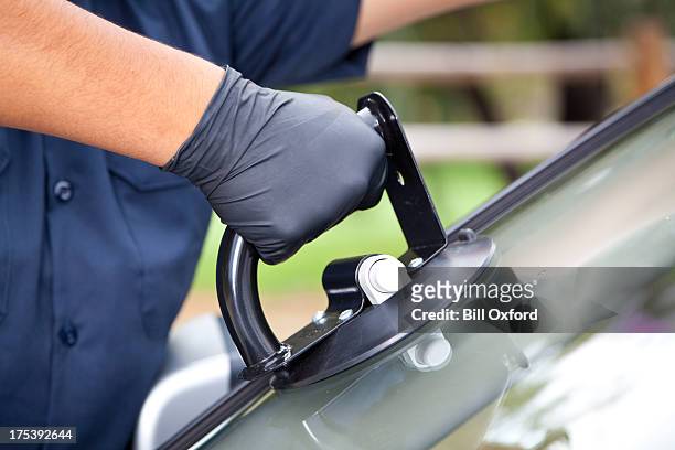 auto glass repair &amp; replacement - putting gloves stock pictures, royalty-free photos & images
