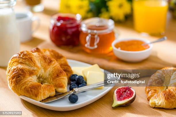 delicious croissants and jam meal - french culture stock pictures, royalty-free photos & images