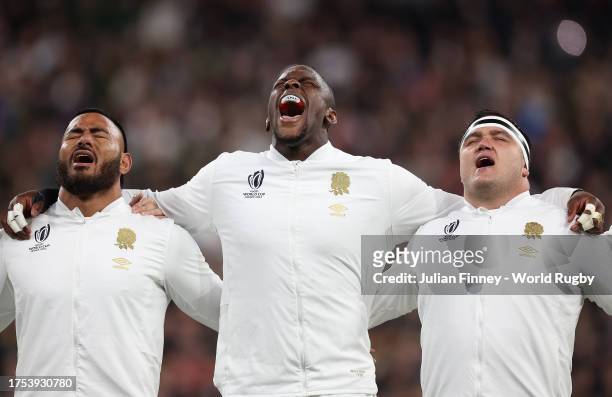 Manu Tuilagi, Maro Itoje and Jamie George of England sing their national anthem prior to the Rugby World Cup France 2023 match between England and...