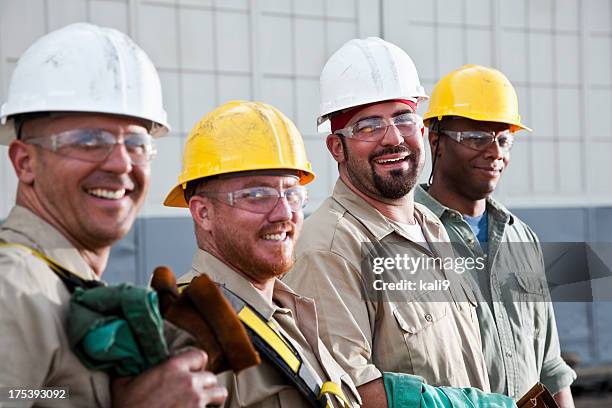 construction workers in safety gear - standing in a row stock pictures, royalty-free photos & images