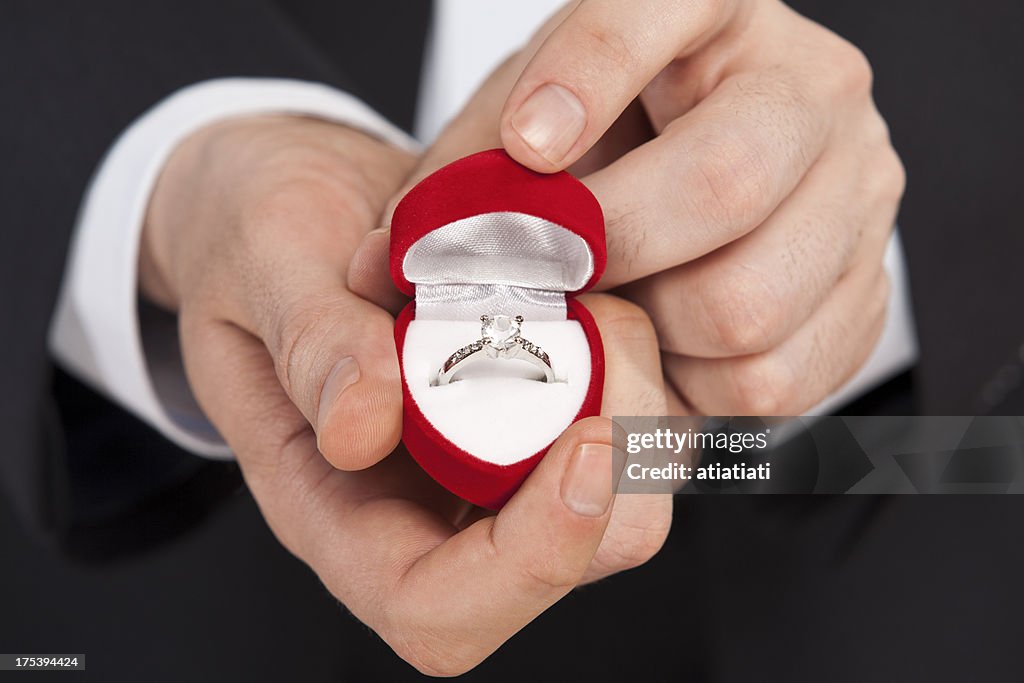 Man giving a diamond ring