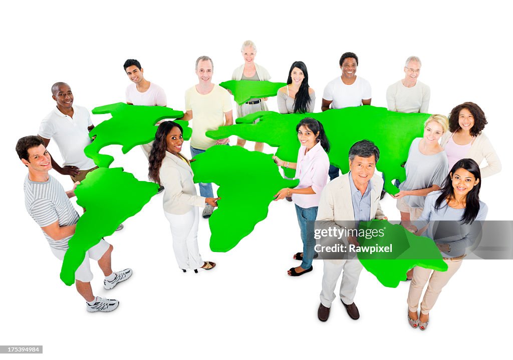 Multi-ethnic group of casual people holding abstract green world map