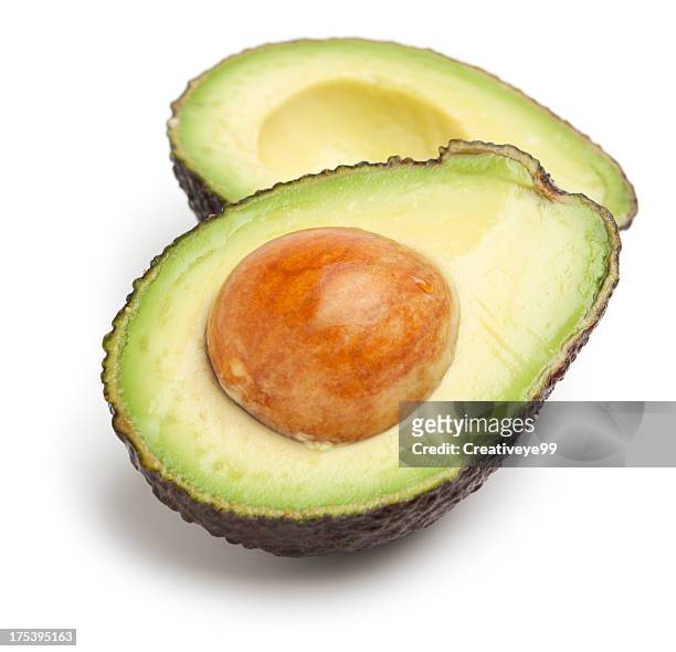abacate metades - avocado isolated imagens e fotografias de stock