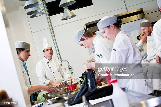 kitchen team at work - restaurant kitchen fridge stock pictures, royalty-free photos & images