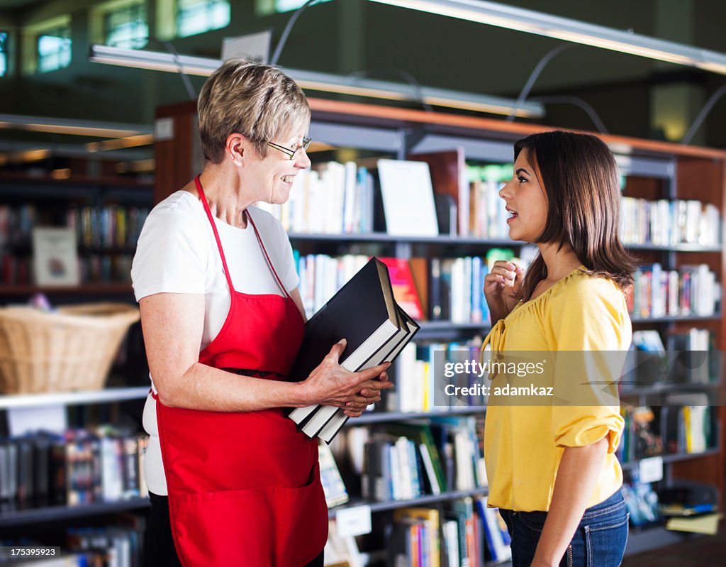 Library Voluteer Volunteer Librarian Helping Student High-Res Stock Photo - Getty Images