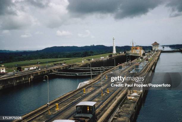 Cargo ship enters a lock on the Panama Canal in the Republic of Panama in Central America circa 1950.