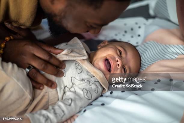 dad and baby: a lifetime of love - short phrase stock pictures, royalty-free photos & images
