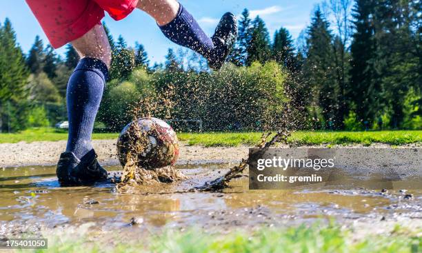 high speed freeze of football kick - unhygienic stock pictures, royalty-free photos & images