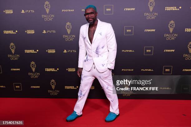 Former French football player Djibril Cisse poses prior to the 2023 Ballon d'Or France Football award ceremony at the Theatre du Chatelet in Paris on...