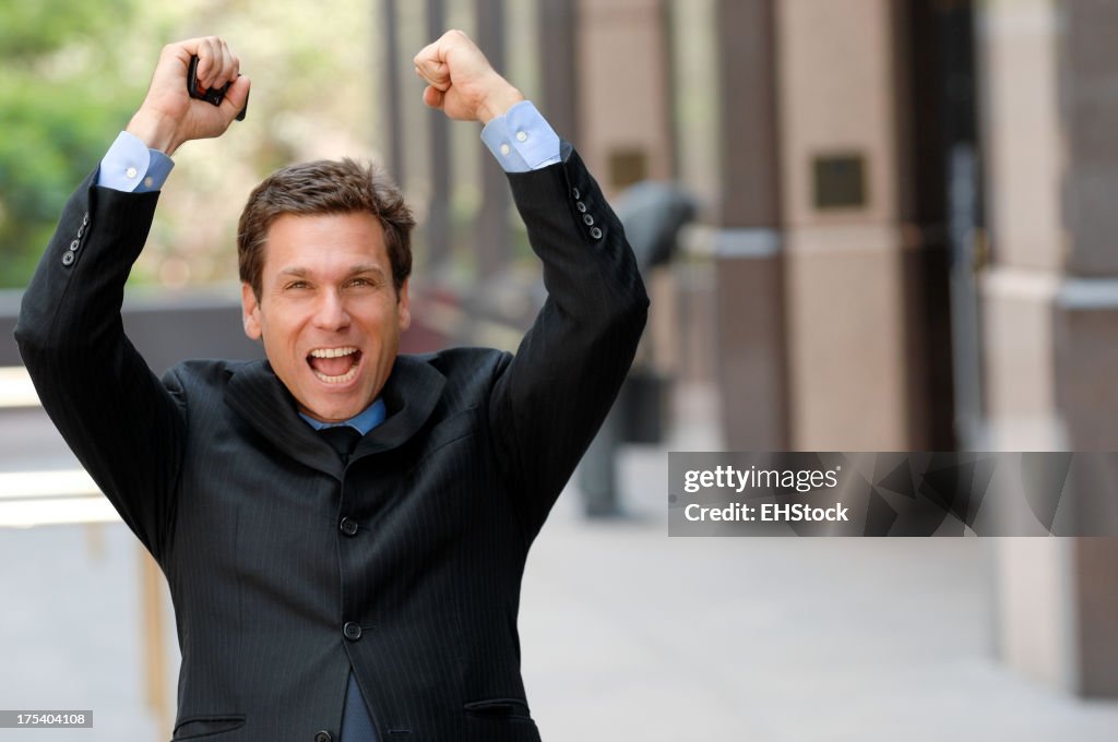 Businessman Celebrating Downtown Business District