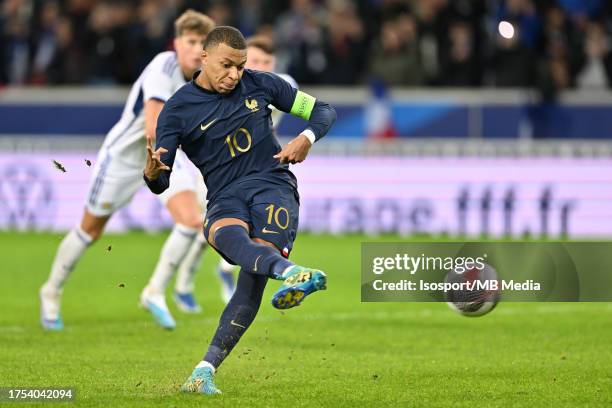 Kylian Mbappe of France scores a penalty for the 3-1 score during a soccer game between the national teams of France and Scotland in friendly game,...