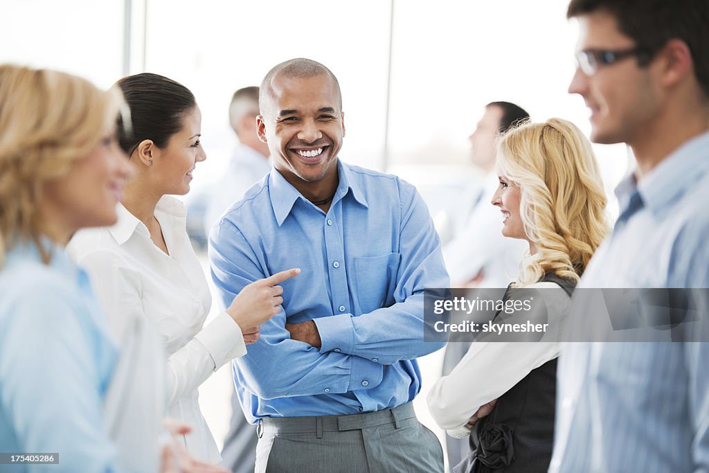 Happy group of businesspeople laughing