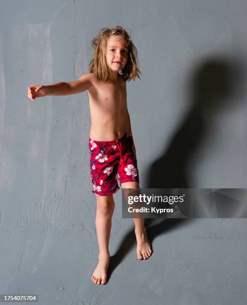 male toddler or child age six years - male feet on face stock-fotos und bilder