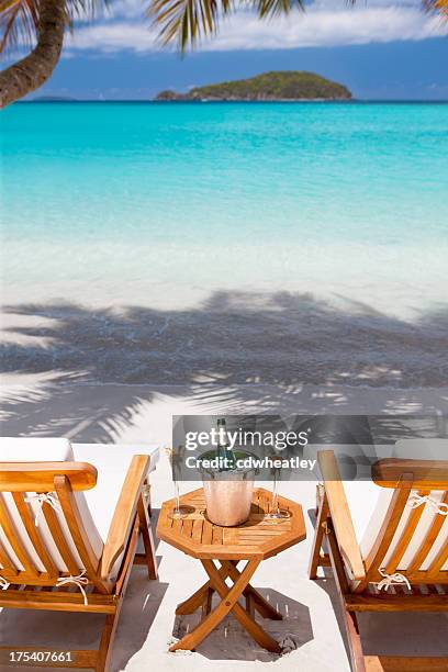 champagne and flutes at a tropical caribbean beach - beach chair stock pictures, royalty-free photos & images