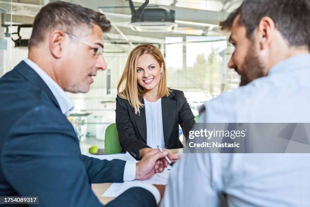 business people in action - female with group of males stock pictures, royalty-free photos & images