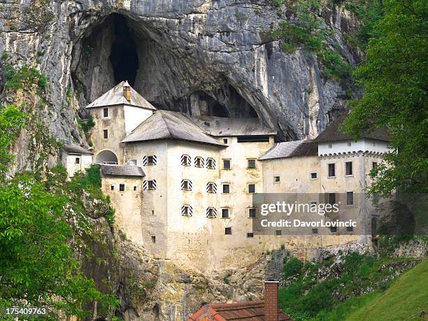 house in the rock - postojna cave stock-fotos und bilder