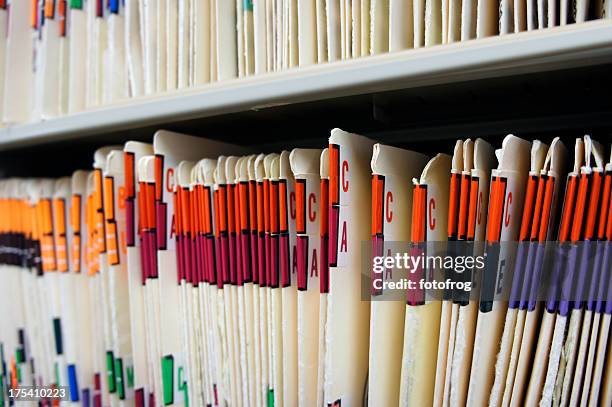 various alphabetized medical records - medisch dossier stockfoto's en -beelden