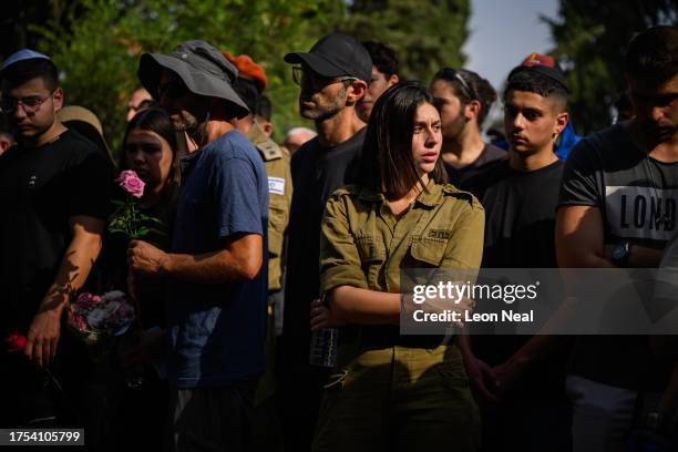 Friends and family pay their respects at the joint funerals of Dana and Carmel Becher, a mother and son who were killed during the Hamas attack of...