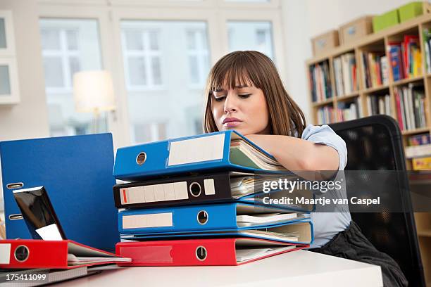 young woman at work - with ringbinders - binder shelves stock pictures, royalty-free photos & images