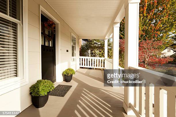 covered front porch - suburban housing stock pictures, royalty-free photos & images